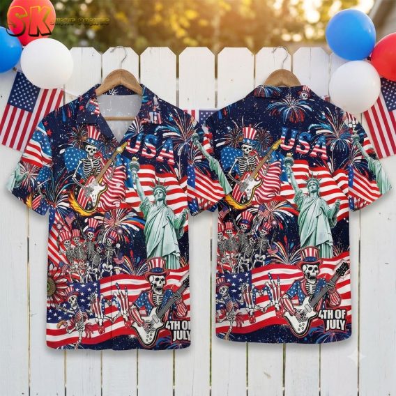 American 250 Hawaiian shirt displayed on ghost mannequin, featuring Uncle Sam skeleton playing guitar, American flags, fireworks, Statue of Liberty, and USA text on a vibrant patriotic pattern
