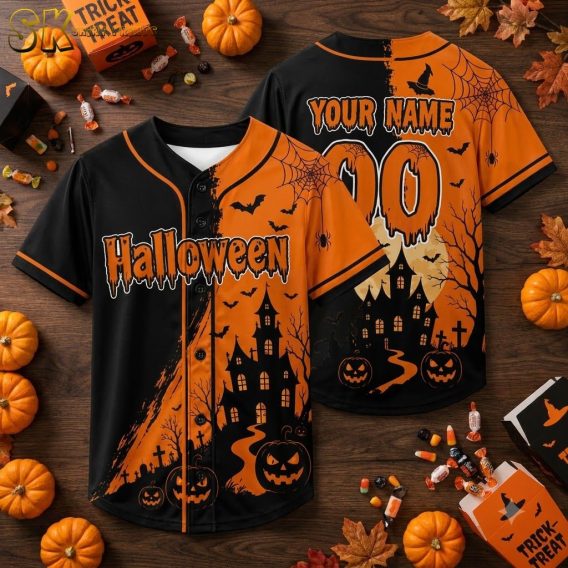 Flat lay display of a pumpkin Hawaiian shirt showing jack-o'-lanterns, haunted house silhouette, bats, and spider webs in orange and black all-over print