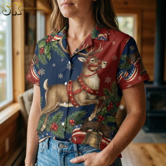 Woman wearing a 250th anniversary Hawaiian shirt, closeup showing reindeer motif with holly, bells, and snowflakes on a red and navy blue background