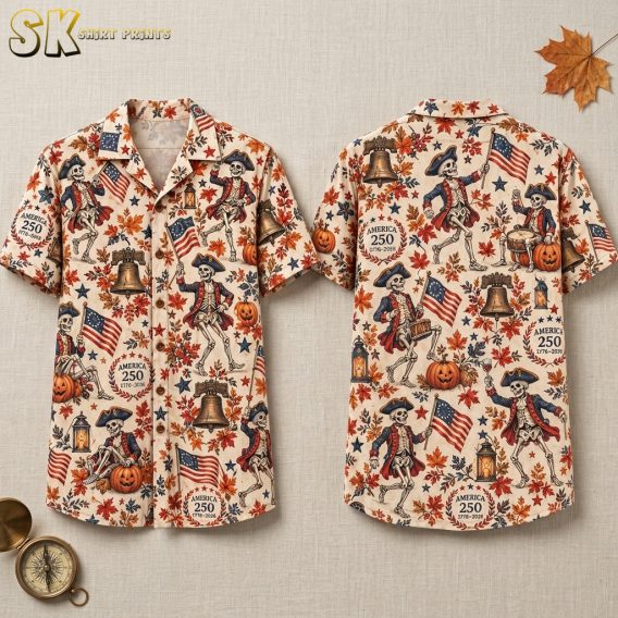 Flat lay of the front and back of a cream halloween themed hawaiian shirt covered in dancing colonial skeleton figures, Liberty Bells, pumpkins, and America 250 anniversary medallions.