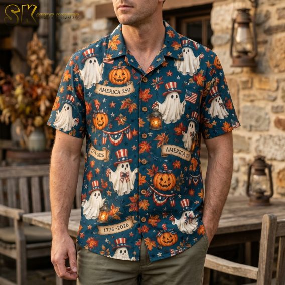 Man wearing a dark blue mens halloween hawaiian shirt printed with patriotic ghosts, pumpkins, American flags, and America 250 anniversary banners.