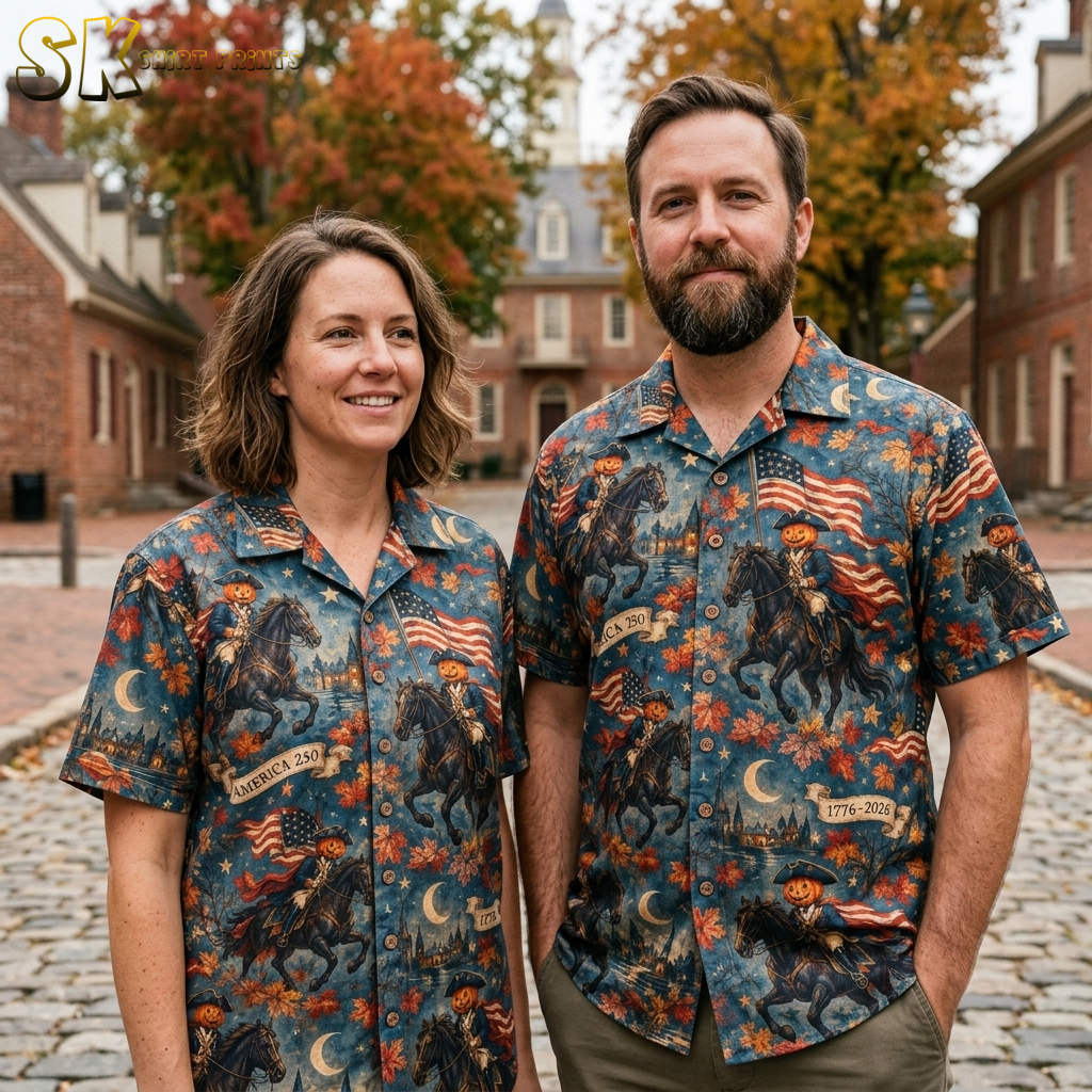 Couple lifestyle photo featuring the halloween hawaiian shirt with pumpkin-headed colonial riders, America 250 banners, and autumn leaf accents on a blue background.