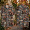 Front and back hanger view of a halloween hawaiian shirt with pumpkin-headed colonial horse riders, American flags, and America 250 banners on a muted blue background.