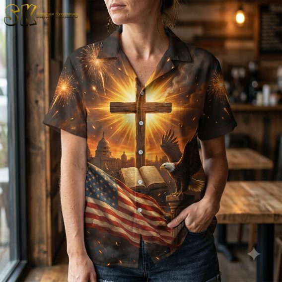 Woman wearing America 250 shirt close-up showing detailed eagle, glowing cross, and US Capitol print in black and gold