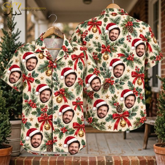 Christmas themed Hawaiian shirt with all-over Santa face pattern, holly leaves, red berries, pine cones, gold stars, and bells on a beige background, shown front and back on hanger