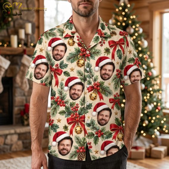 Man wearing a funny Christmas Hawaiian shirt with repeating Santa face pattern, holly, bells, and gold stars on a beige background