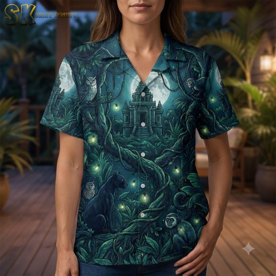 Female closeup of a Halloween costume white shirt with luminescent silver firefly and twisting vine print on midnight blue and emerald green fabric