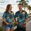Couple wearing Halloween Hawaiian shirts from the full color collection, showing haunted graveyard design with pumpkins, bats, and gothic mausoleum