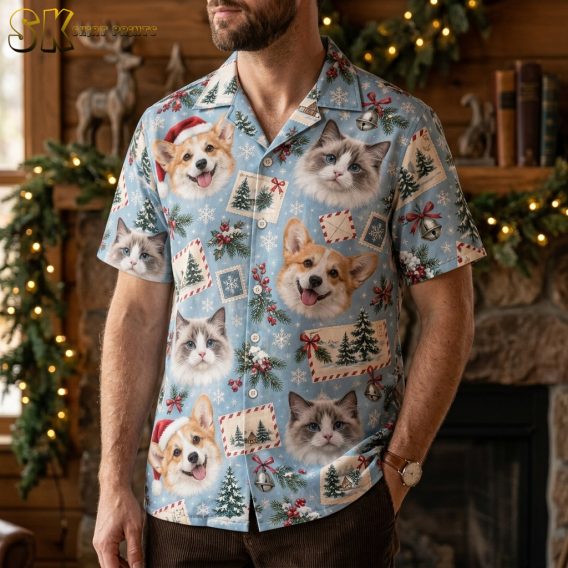 Man wearing a Hawaiian Christmas shirt with corgi dogs in Santa hats and cats on a light blue background, festive holiday print