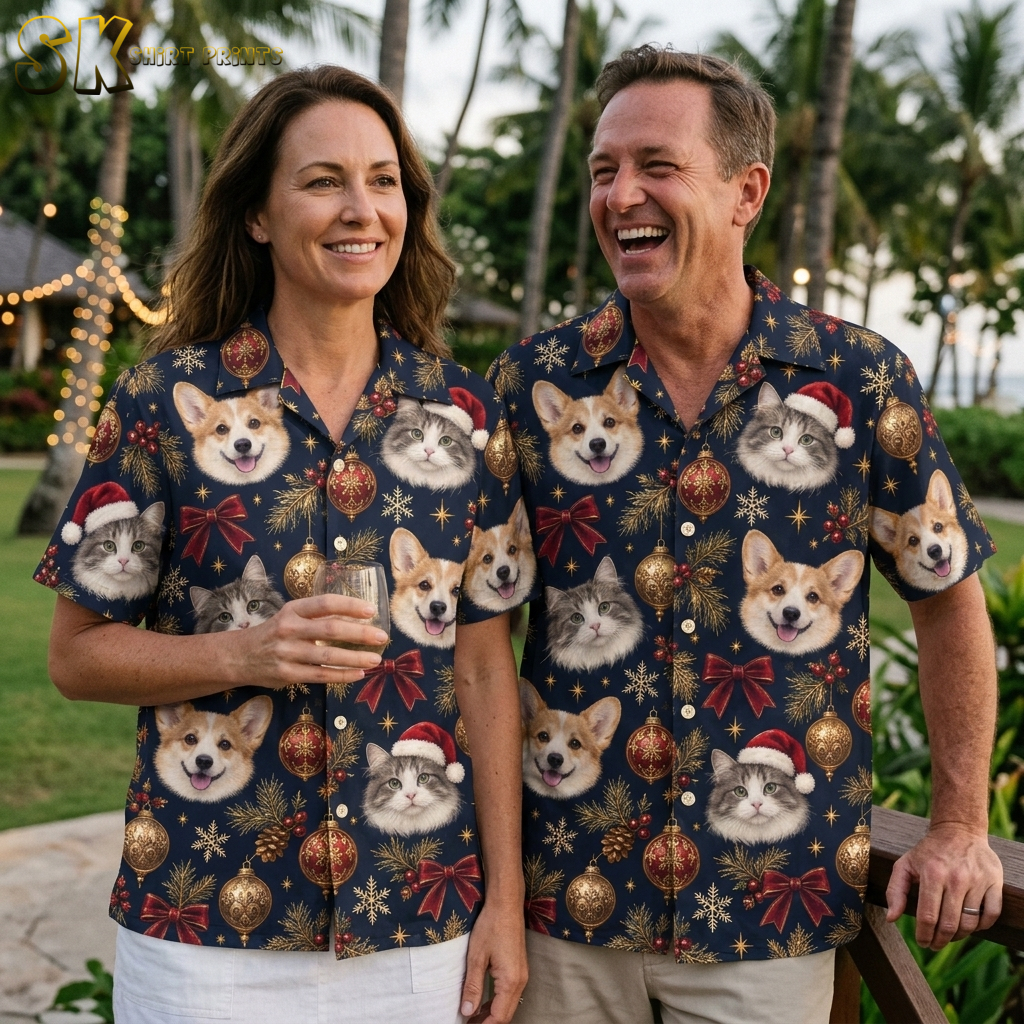 Couple wearing matching Hawaiian Christmas shirts for men and women, dark blue short-sleeve button-ups with corgi and cat Santa hat pattern, gold ornaments, and red holiday accents