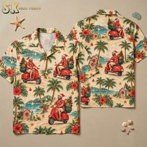 Flat lay of a hawaiian shirt with santa claus print showing front and back panels with Santa on a scooter, palm trees, hibiscus, Christmas trees, and beach huts on cream and red fabric