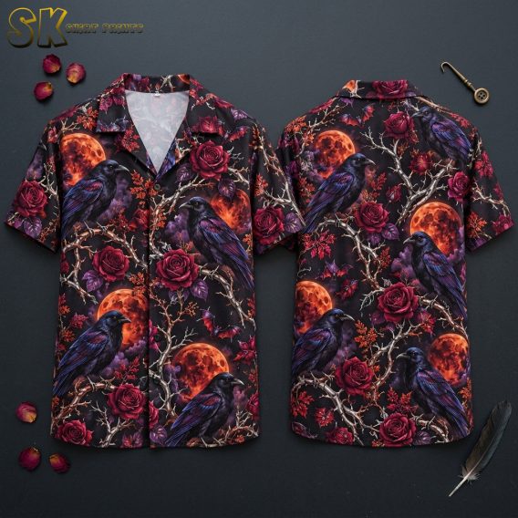 Flat lay of front and back of a black horror hawaiian shirt covered in crows on bare branches, red roses, orange blood moons, dark clouds, and bats.