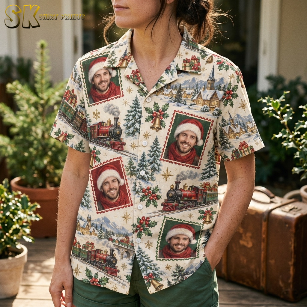 Female close-up of a ladies christmas hawaiian shirt showing detailed Santa portrait stamp motifs in red and green frames with holly bells and snowy village print on cream fabric