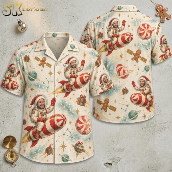 Front and back flat lay of a long sleeve Hawaiian Christmas shirt with astronaut Santa riding a candy cane rocket, gingerbread men, planets, and stars in cream, red, and green