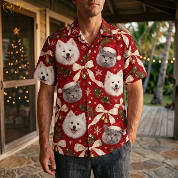 Man wearing a mens Christmas Hawaiian shirt with red background, dog and cat Santa hat portraits, gold bells, and festive snowflake pattern