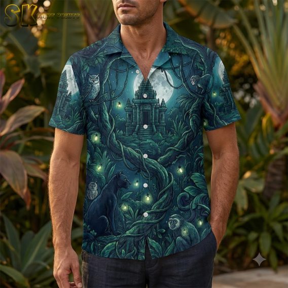 Man wearing a mens Halloween Hawaiian shirt with midnight blue jungle temple and twisting vine pattern in emerald green and deep teal