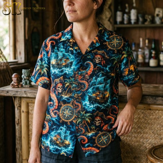 Close-up of a woman wearing a black scary hawaiian shirt, highlighting the detailed pirate skull, sailing ship, and octopus tentacle artwork.