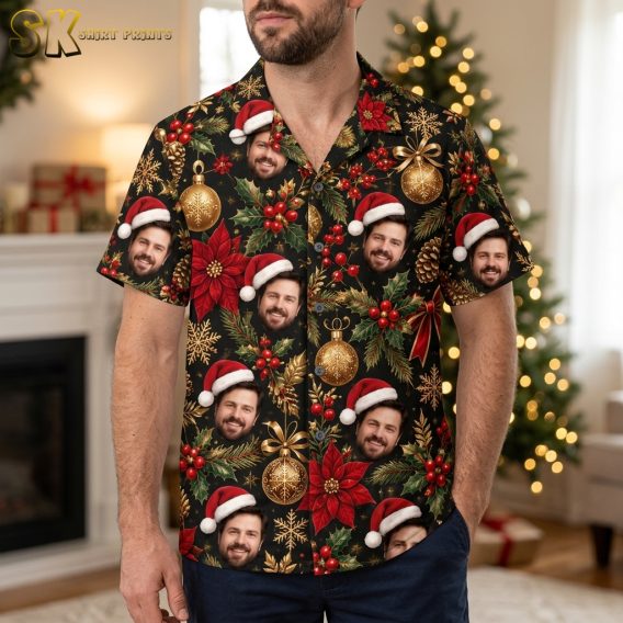Man wearing a santa hawaiian shirt with black background print featuring Santa faces, poinsettias, holly, and Christmas ornaments