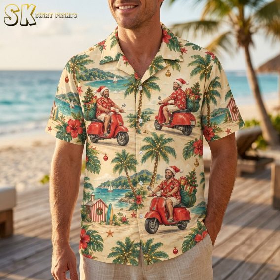 Man wearing a santa hawaiian shirt with a tropical Christmas print featuring Santa on a scooter, palm trees, and hibiscus flowers in cream and red
