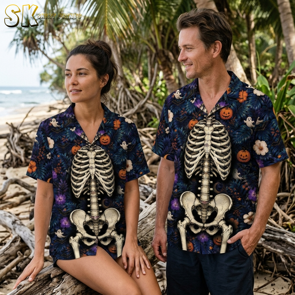 Couple wearing matching spooky Hawaiian shirts with skeleton, pumpkin, and ghost print in dark blue and orange for Halloween