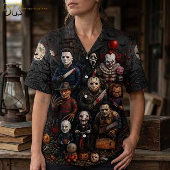 Close-up of a woman wearing a spooky Hawaiian shirt showing detailed horror characters, pumpkins, and jack-o-lanterns on a black and orange all-over print