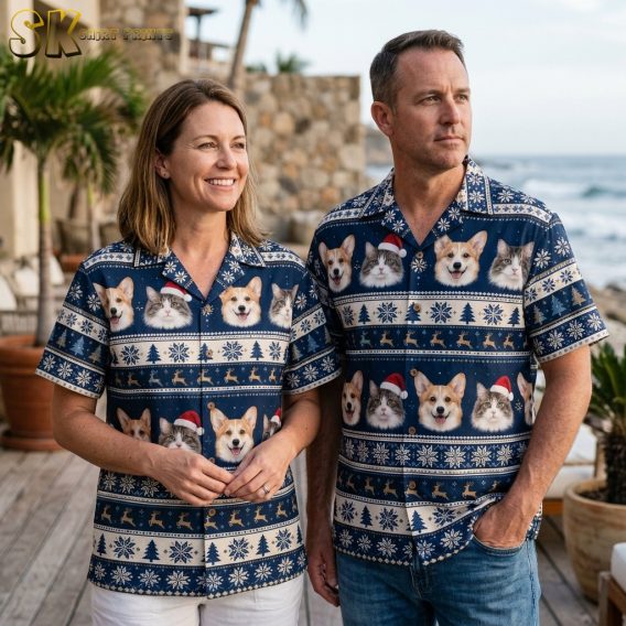 Couple wearing matching tropical Santa shirts with a navy blue dog and cat Santa hat pattern in a lifestyle photo