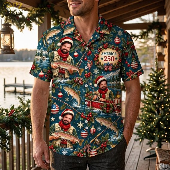 A man wearing the deep blue Christmas fishing Hawaiian shirt, showing how the all-over print of the Santa-hat fisherman, red boat scenes, and patriotic ornaments looks on a male figure in a casual setting.