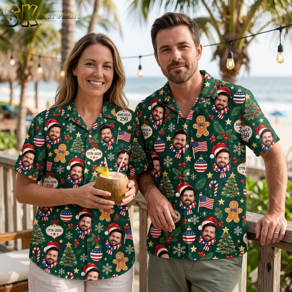 A couple shown together, with the dark green patriotic Christmas Hawaiian shirt visible, featuring the repeated smiling bearded face in a Santa hat, AMERICA 250 ornaments, and red-white-and-blue holiday motifs across the fabric.