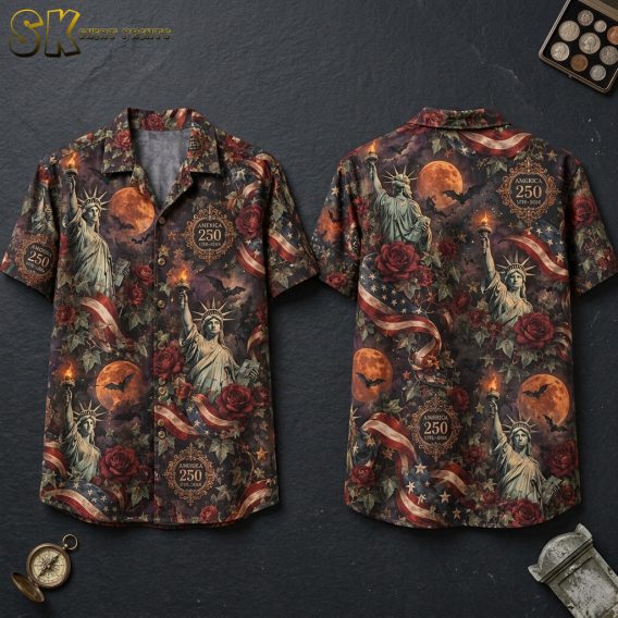Front and back hanger view of a halloween hawaiian shirt with Statue of Liberty, orange moons, bats, roses, and America 250 labels on a dark blackish-brown base.