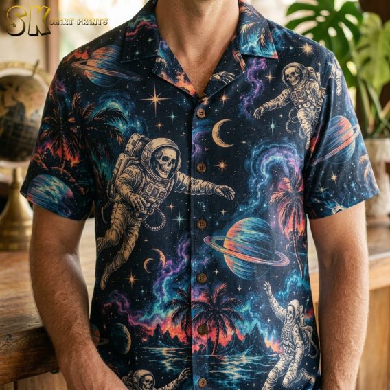 Man wearing a dark navy mens halloween hawaiian shirt covered in floating astronauts, ringed planets, palm trees, and swirling nebulae in teal, purple, and orange.