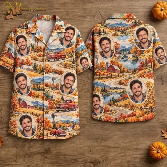Front and back of a short-sleeve shirt laid on wood, featuring autumn farm scenes and repeated oval portraits of a smiling man.