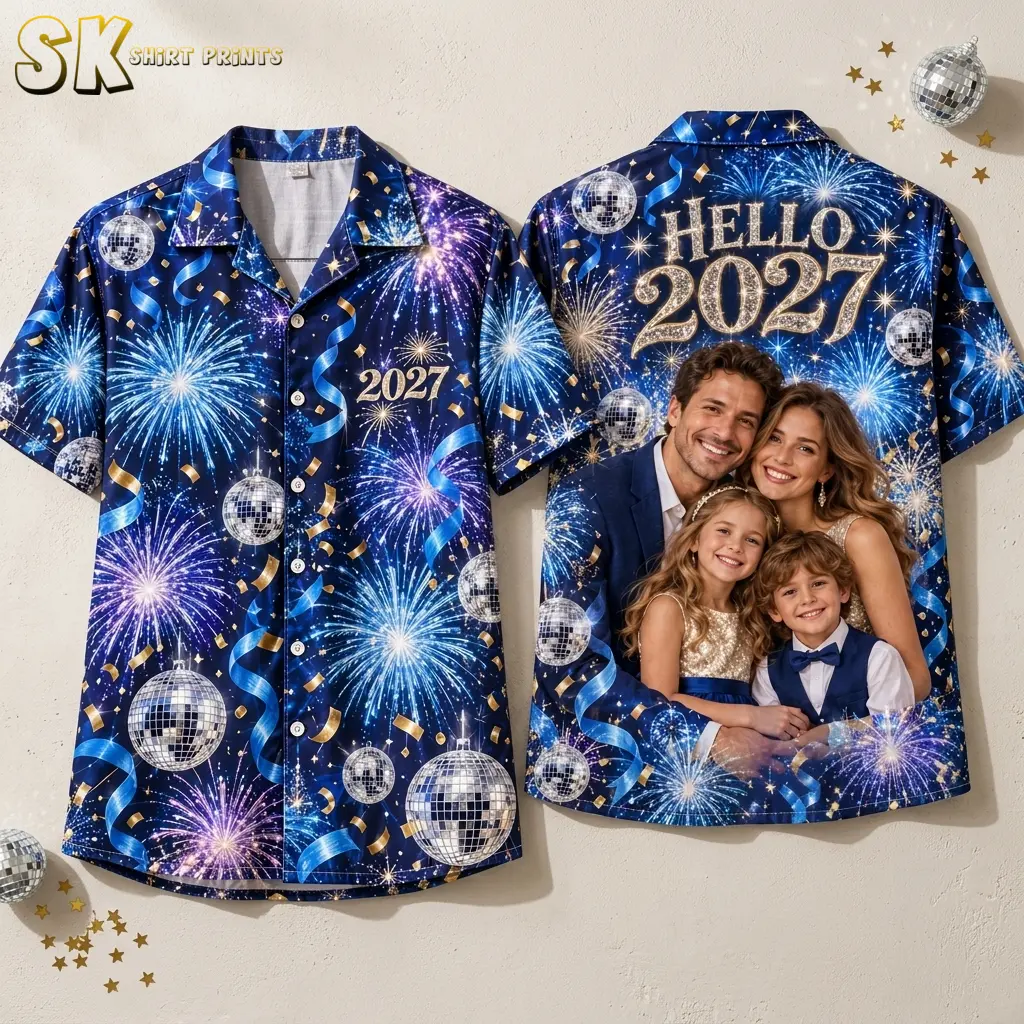 Navy fireworks shirt displayed front and back against a light wall, with gold “HELLO 2027” lettering above a printed family portrait.