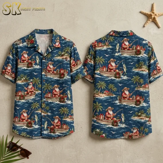 Front and back of a blue Santa Hawaiian shirt displayed on a beige surface beside a starfish and sunglasses.