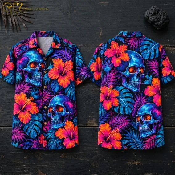 Front and back of a Halloween Hawaiian shirt lie on dark wood, displaying blue skulls and bright orange-pink hibiscus flowers.