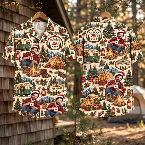 Flat-lay front and back views of the short-sleeve button-up shirt showing the full all-over pattern of campfire scenes, vintage green camper vans, Christmas trees, and AMERICA 250 text plaques on a beige background.
