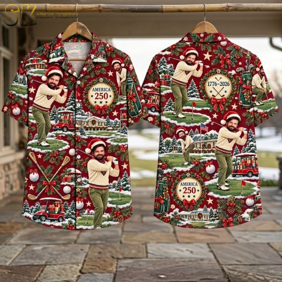 Front and back flat-lay views of the deep red short-sleeve button-up shirt, showing the full spread of the repeating Christmas golf pattern including the Santa-hat golfer, golf carts carrying gift boxes, snow-covered pine trees, and a large holiday-decorated building.