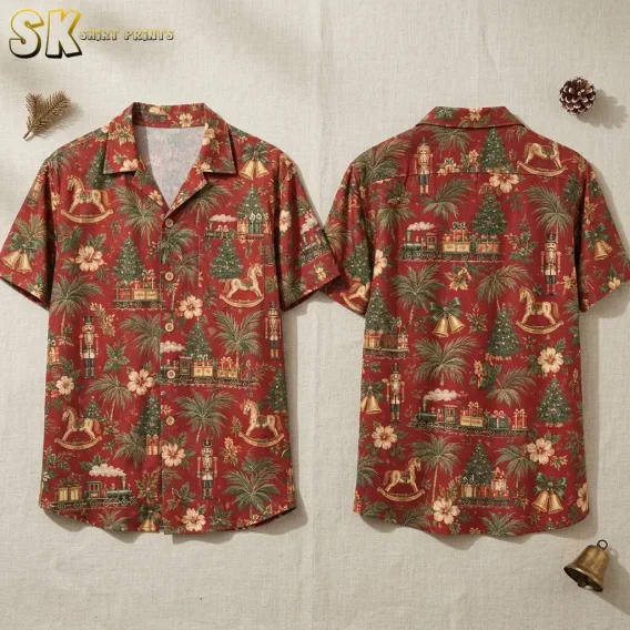 Front and back views of a christmas hawaiian shirt displayed flat on a linen surface, showing the all-over pattern of Christmas trees, toy trains, rocking horses, nutcracker soldiers, palm leaves, hibiscus flowers, and gold bells on a reddish-brown background.
