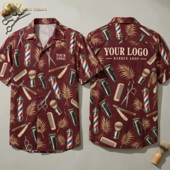Front and back views of a custom hawaiian shirt with company logo showing barber poles, scissors, clippers, combs, and palm leaves on a deep maroon background, with 'YOUR LOGO BARBER SHOP' printed across the back.