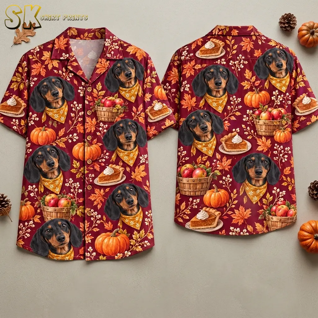 Front and back of a maroon Thanksgiving button up shirt laid flat beside pumpkins and pinecones, with dachshund and harvest illustrations.