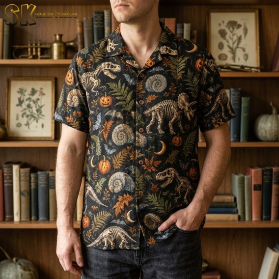 A man wearing the black camp collar shirt with a skeletal dinosaur and pumpkin print, shown in a lifestyle setting.