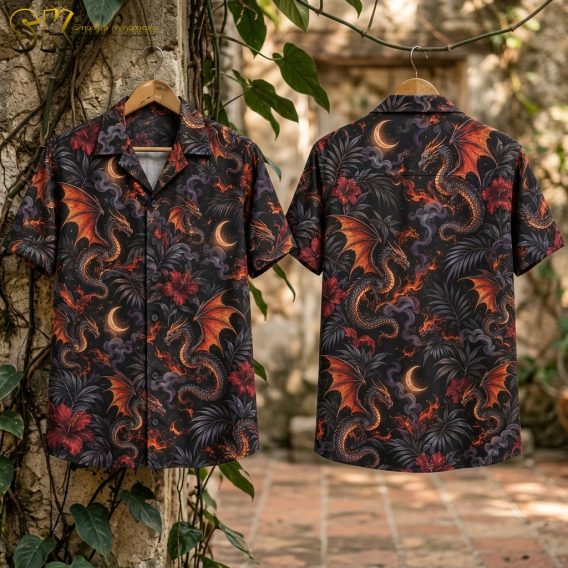 Flat-lay view of the black short-sleeve shirt laid out to show both the front and back, with the all-over repeating pattern of fire-breathing dragons, crescent moons, red hibiscus, and dark palm leaves clearly visible.