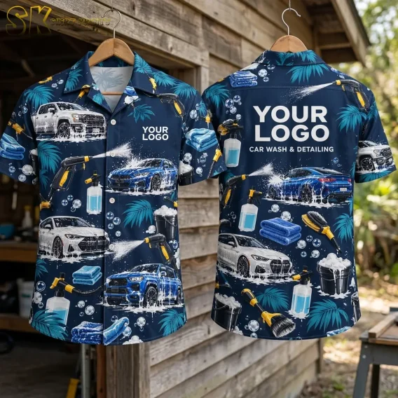 Front and back of the logo hawaiian shirt are displayed on wooden hangers against a rustic wood-plank wall, showing the full all-over car wash pattern on the front and the large back logo block with 'CAR WASH & DETAILING' beneath it.