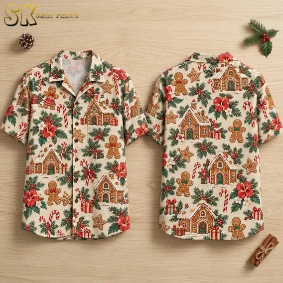 A cream Christmas themed Hawaiian shirt is laid out front and back on a wood surface, showing gingerbread houses and candy canes.