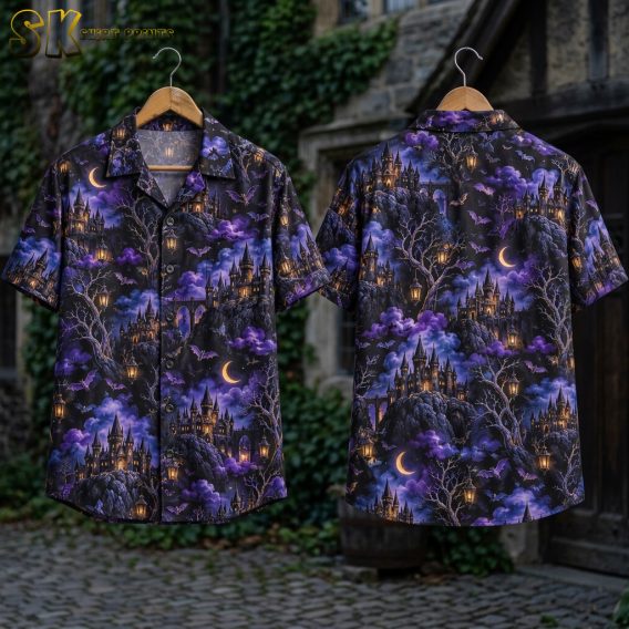Flat lay of the front and back of a horror hawaiian shirt showing gothic castles, bats, crescent moons, and hanging lanterns across a dark purple and black all-over print.