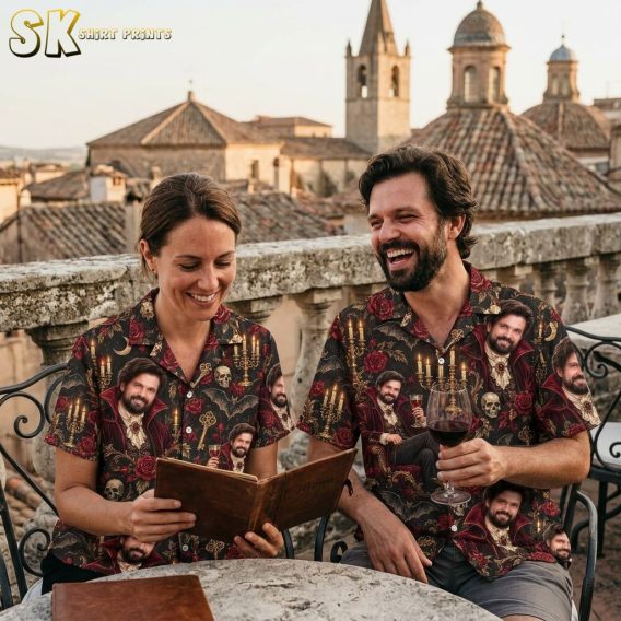 A couple shown together, with the shirt's black base and repeating Victorian vampire motif visible, including details of skulls, bats, and antique golden keys across the fabric.
