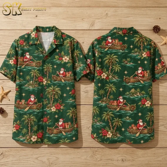 A green Christmas Hawaiian shirt is laid out front and back on wooden boards, showing Santa rowing boats among tropical islands.