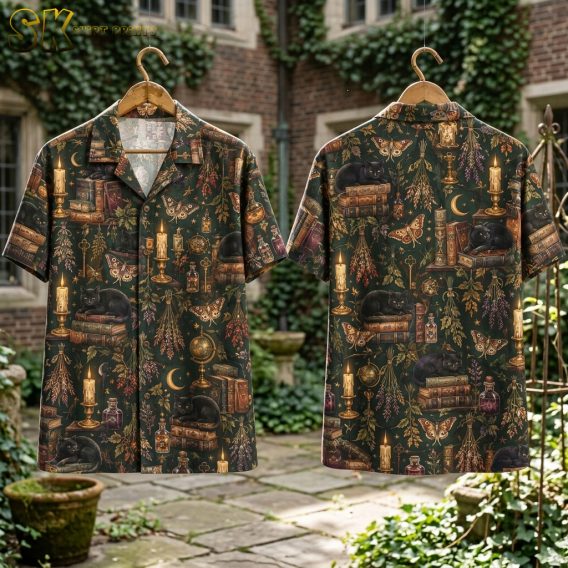 Front and back of a dark green halloween hawaiian shirt featuring black cats on books, lit candles, crescent moons, and moths in warm browns and golds.