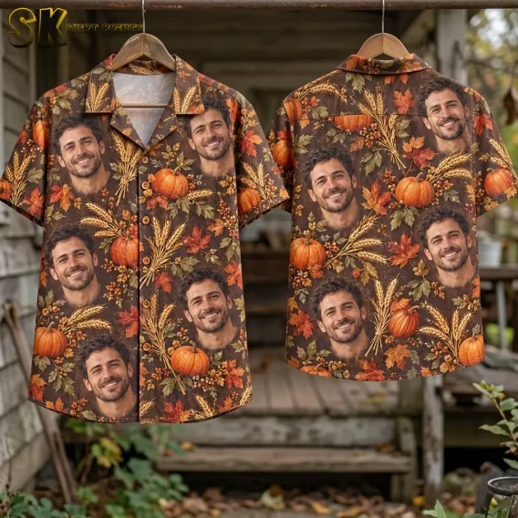 Front and back of brown harvest-print shirts hang from wooden hangers, displaying repeated smiling male faces among pumpkins and autumn leaves.