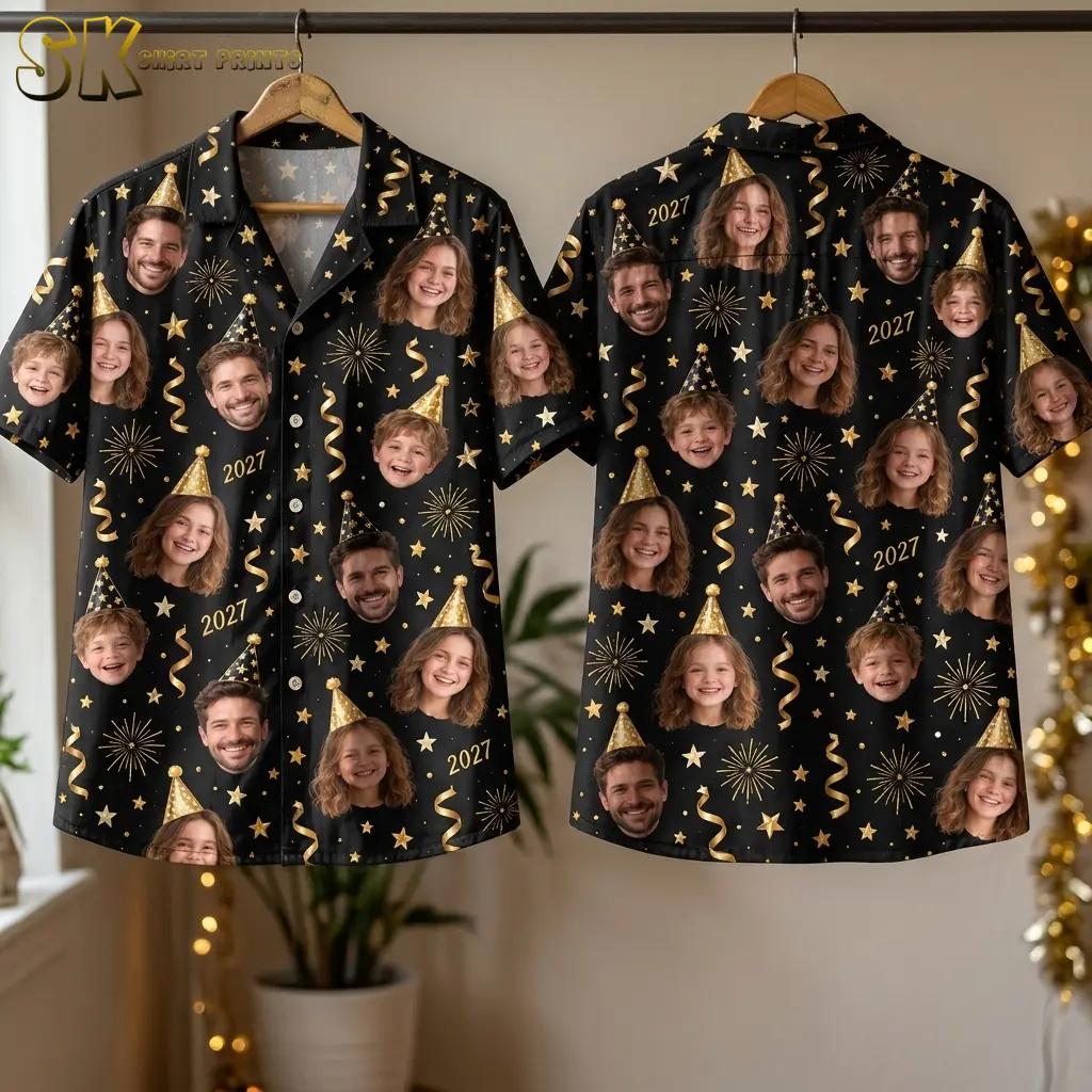 Two black face-print shirts hang side by side, displaying the buttoned front and patterned back with gold stars and 2027 lettering.