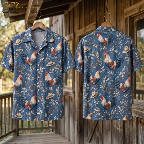 Two blue rooster-print shirts hang from wooden hangers on a porch, displaying the front and back.
